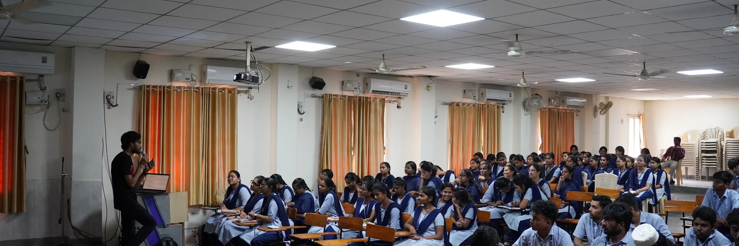 Students filling a college seminar hall for a WIN Education session