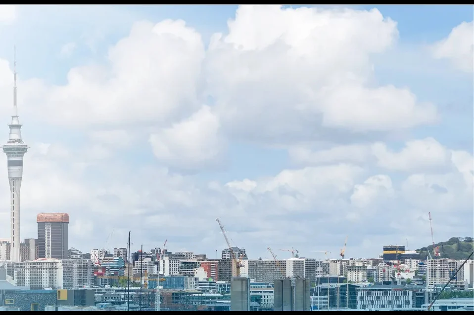 The Auckland Sky Tower and harbour skyline in New Zealand